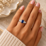 9ct white gold blue sapphire and diamond ring worn on hand
