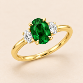 9ct yellow gold lab-grown emerald and diamond three-stone ring, angled view