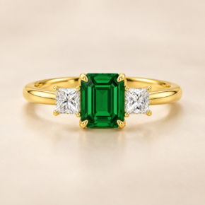 9ct yellow gold lab-grown emerald and diamond three-stone ring, front view