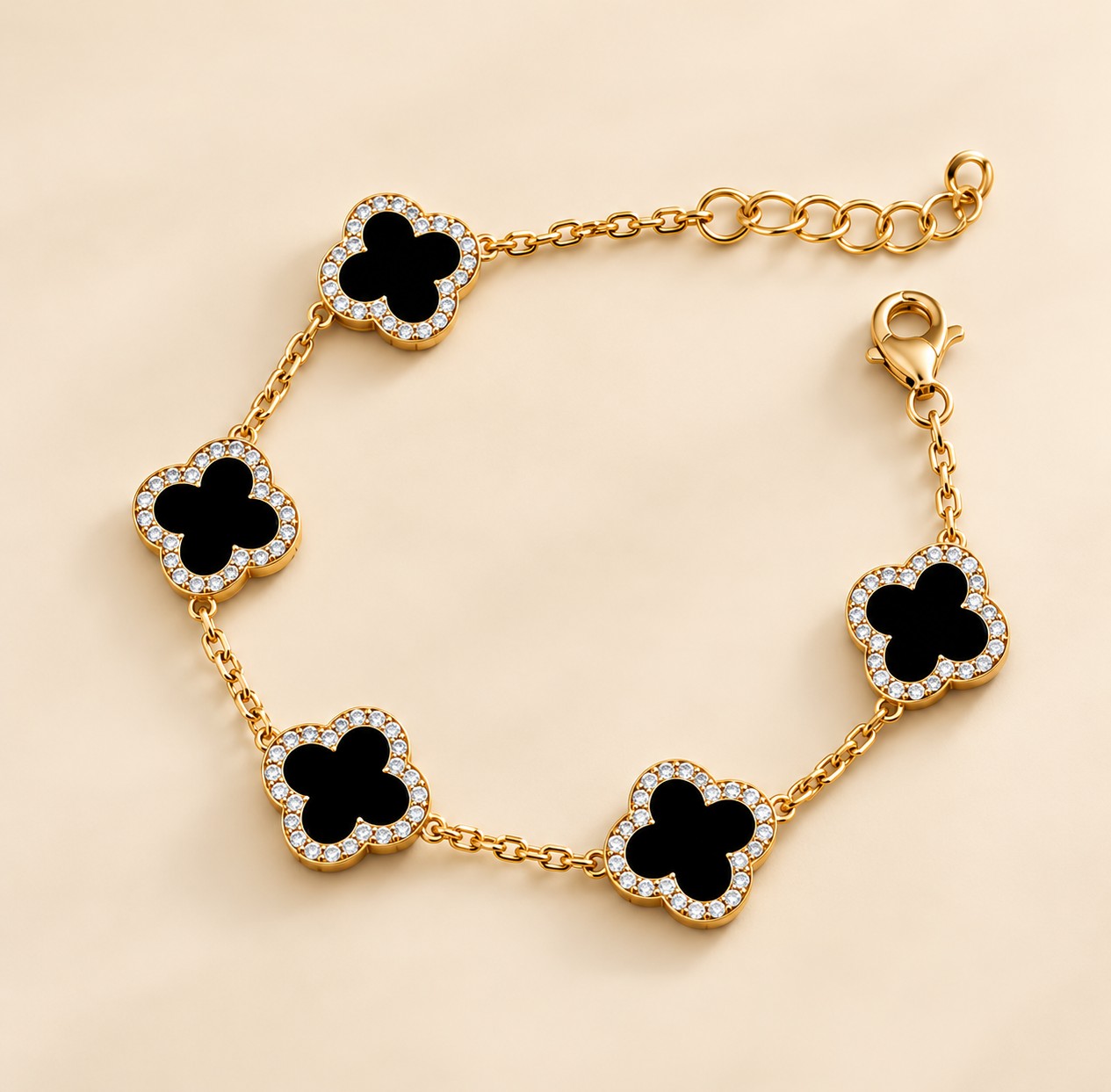 Gold-plated bracelet with five black onyx clover motifs