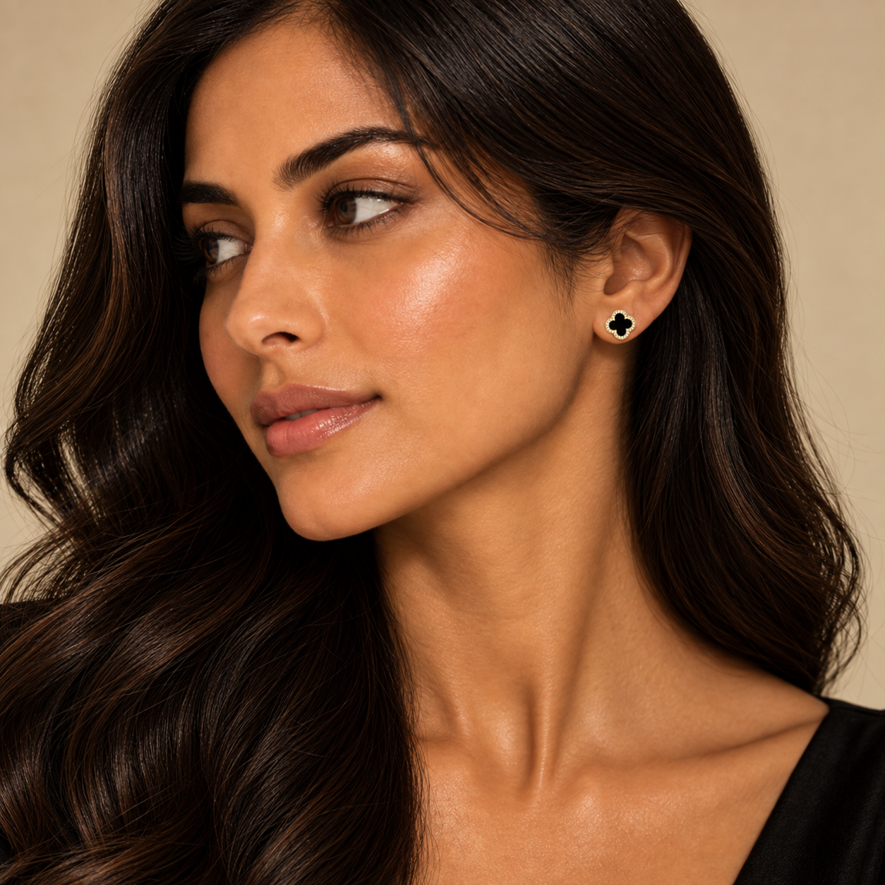 Model wearing London Facets black clover earrings