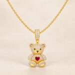 Gold-plated sterling silver CZ teddy bear necklace on adjustable rolo chain.