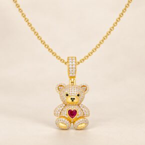 Gold-plated sterling silver CZ teddy bear necklace on adjustable rolo chain.