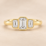Front view of 9ct yellow gold three-stone emerald-cut lab-grown diamond ring