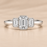 Front view of 9ct white gold three-stone emerald-cut lab-grown diamond ring