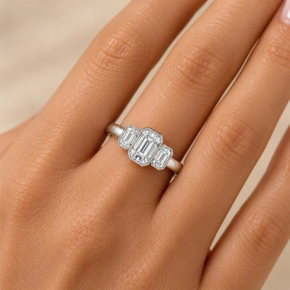 9ct white gold emerald-cut lab-grown diamond three-stone ring worn on the hand