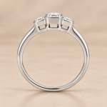 Side view of 9ct white gold three-stone emerald-cut lab-grown diamond ring with rub-over settings