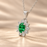 9ct white gold lab-grown emerald and diamond cluster pendant, angled view