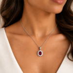 On-model view of a 9ct white gold lab-grown ruby and diamond halo necklace