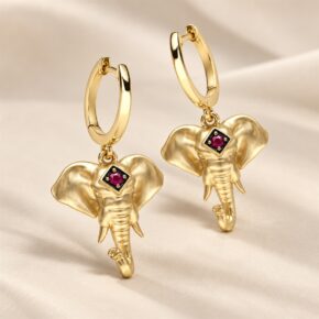 9ct yellow gold ruby elephant earrings, angled product view.