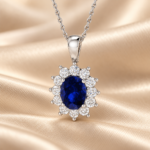 Front view of a 9ct white gold lab-grown blue sapphire and diamond halo necklace